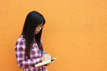 Image showing Asian woman reading and studying