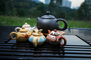 Image showing Chinese tea set with tea pots