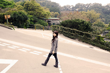 Image showing Stylish asian woman in a park