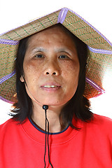 Image showing A 50s asian woman wearing hat