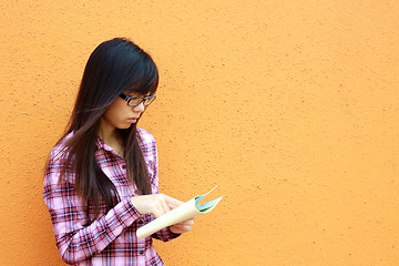 Image showing Asian woman reading and studying