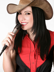 Image showing Friendly country girl with a microphone