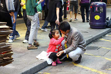 Image showing Father and daugher along the street in Hong Kong 