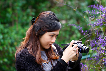 Image showing Female photographer outdoor