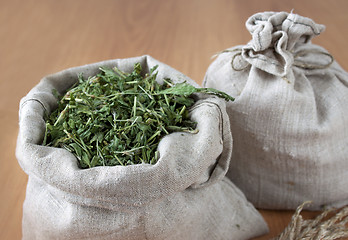 Image showing Dried herbs in linen bags