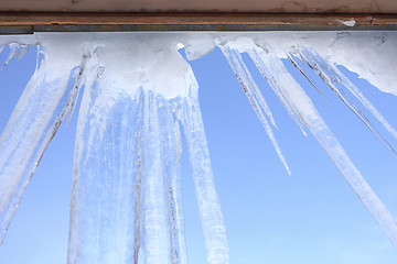 Image showing Icicles hang on the eaves