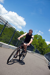 Image showing Man Riding a Bike