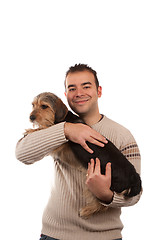 Image showing Man Holding a Borkie Dog