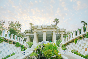 Image showing Pavilion decorated with mosaic in Park Guell starting the sunset