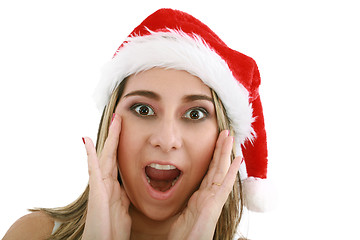 Image showing woman in santa hat surprised for Christmas. 