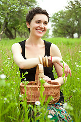 Image showing woman with basket in the garden 