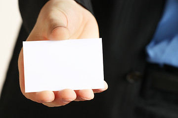 Image showing card presented by a business man