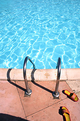 Image showing flip-flops near the swimming pool