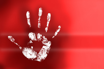 Image showing handprint on red background