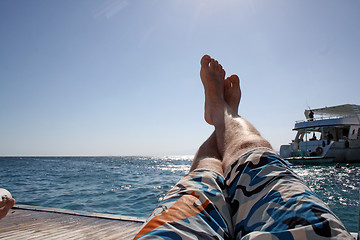 Image showing man relaxes on the open sea