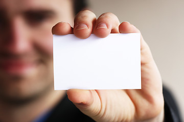 Image showing Businessman shows business card