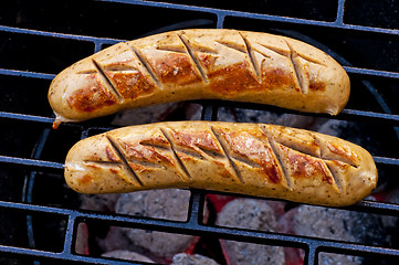 Image showing roasted sausage on barbecue