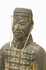 Image showing acupuncture needles with chinese antique soldier