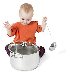 Image showing baby with big cooking pot