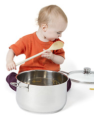 Image showing baby with big cooking pot