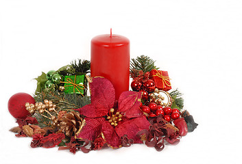 Image showing Red Christamas candle in poinsettia setting