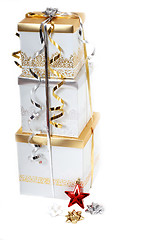 Image showing Gold and silver wrapped Christmas gifts