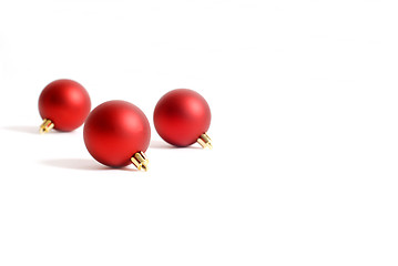 Image showing Three round red Christmas ornaments