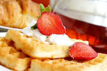 Image showing Tasty breakfast - tea, croissants, wafers