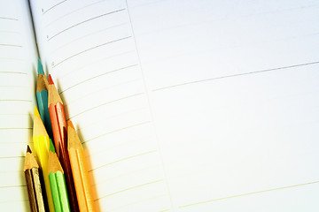 Image showing Color pencil and agenda