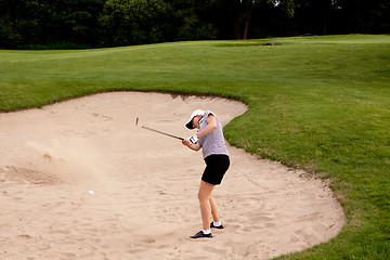 Image showing woman is playing golf on course  summer