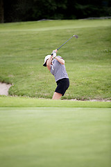 Image showing woman is playing golf on course  summer