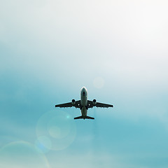 Image showing Silhouette of passenger airplane flying in the sky