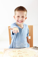 Image showing Boy baking cookies