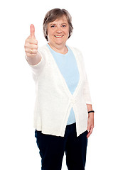 Image showing Smiling old lady showing thumbs up gesture