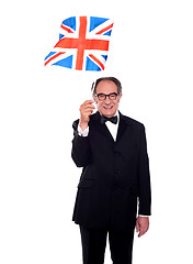 Image showing Senior UK supporter holding nations flag