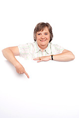 Image showing Beautiful old lady pointing at whiteboard