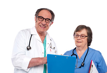 Image showing Senior doctors reading medical report