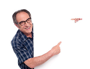 Image showing Man pointing at white blank poster