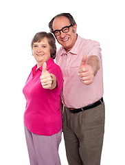 Image showing Senior couple gesturing thumbs up