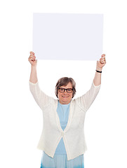 Image showing Woman holding blank banner ad over her head