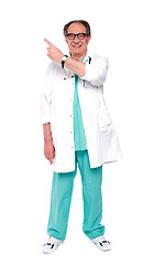 Image showing Full length image of doctor indicating up
