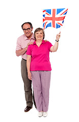 Image showing Old couple waving UK flag. Supporting nation