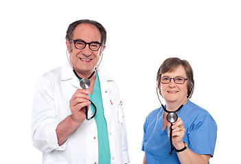 Image showing Smiling aged male and female doctors