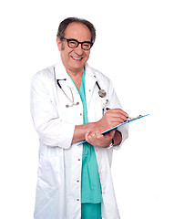 Image showing Friendly male doctor with a clipboard