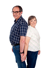 Image showing Affectionate couple posing back to back
