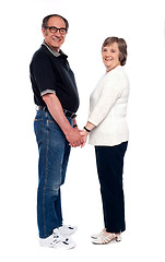 Image showing Love couple holding hands. Full length shot