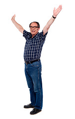 Image showing Mature man standing with open arms