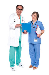 Image showing Doctor and nurse analyzing report together