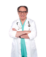 Image showing Senior doctor posing with arms crossed
