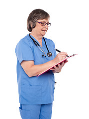 Image showing Medical specialist studying report